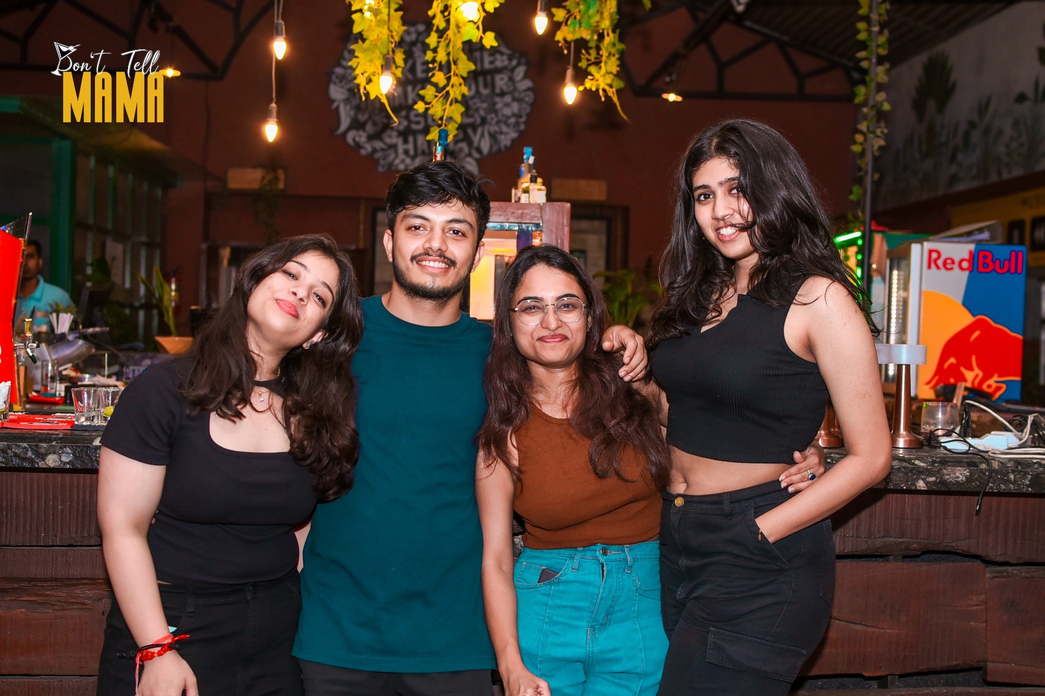 Guests raising a toast together at the bar